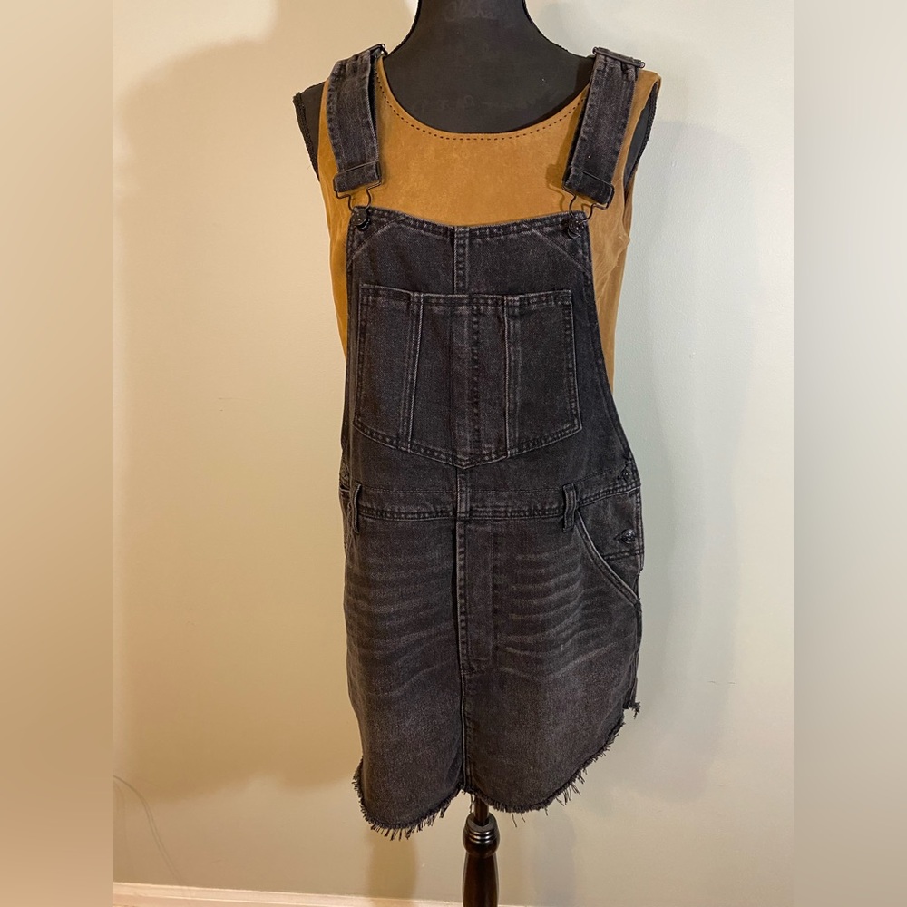 Black denim overall dress with frayed hem and adjustable straps free people